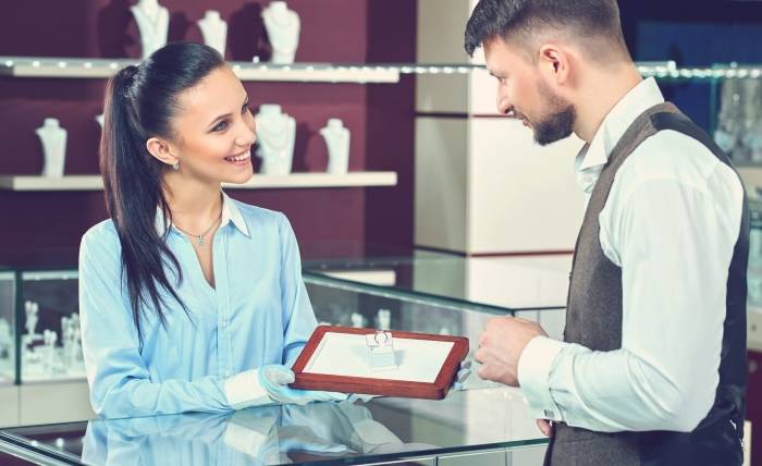How Can You Test the Authenticity of a Diamond Without a Professional Appraisal? handsome young man buying jewelry local jewelry store 7502 7609